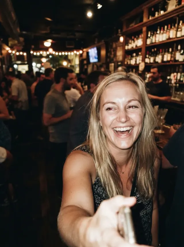 Blurry Mid-Laugh Bar Selfie Portrait