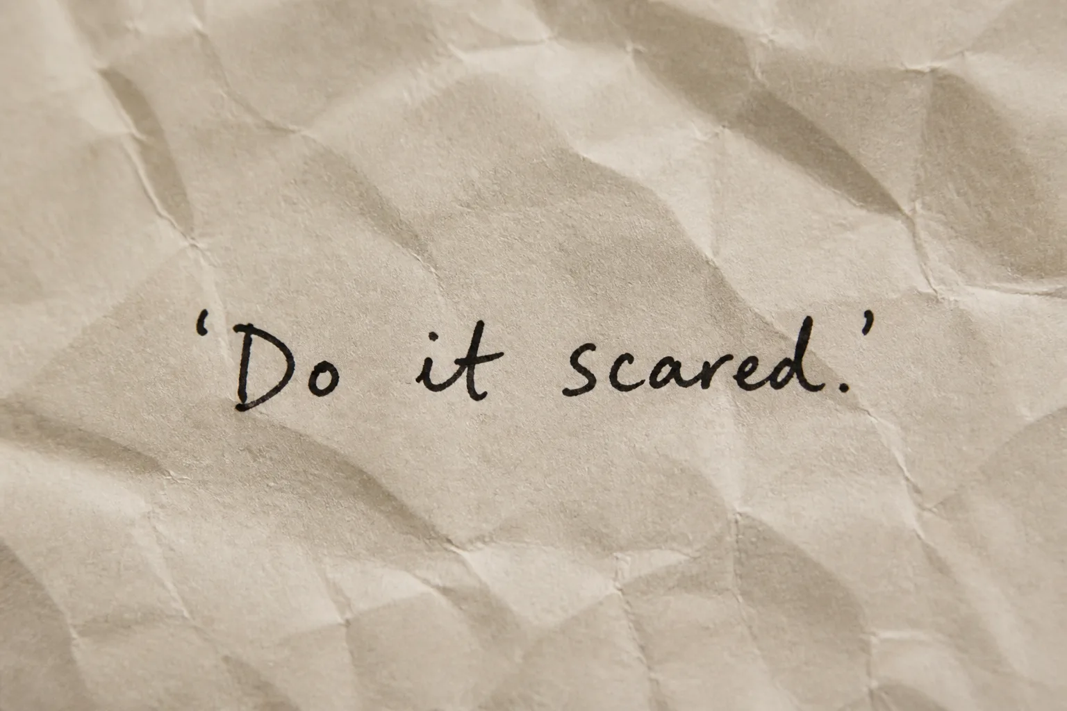 Handwritten Quote On Crumpled Paper