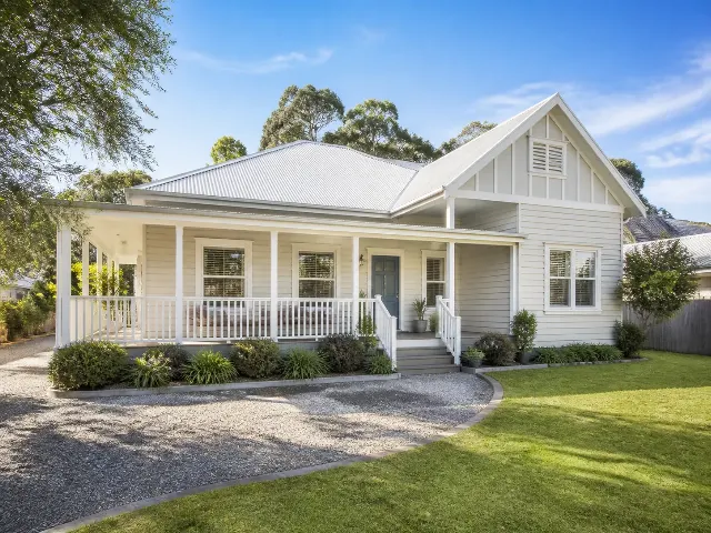 Sunny Coastal Cottage Exterior Listing Photo