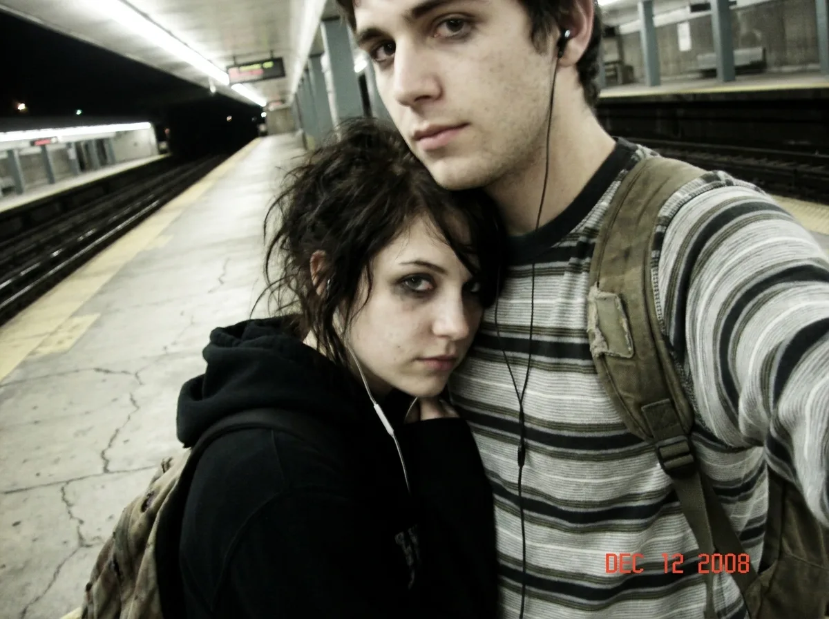 Goth Couple Train Platform Phone Photo