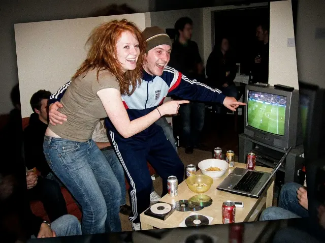 Grainy 2000s Football Watch Party Photo