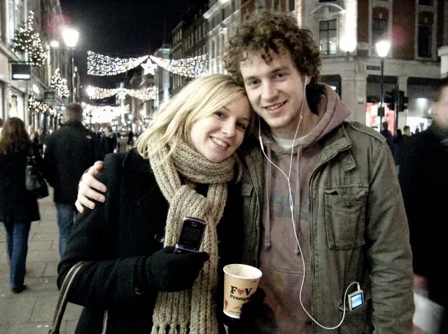 Noisy 2000s Christmas Street Couple Photo