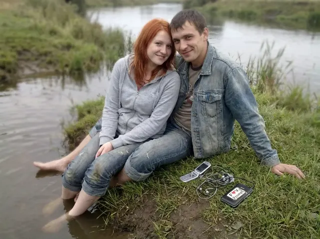 Washed-Out Riverbank Couple Phone Photo