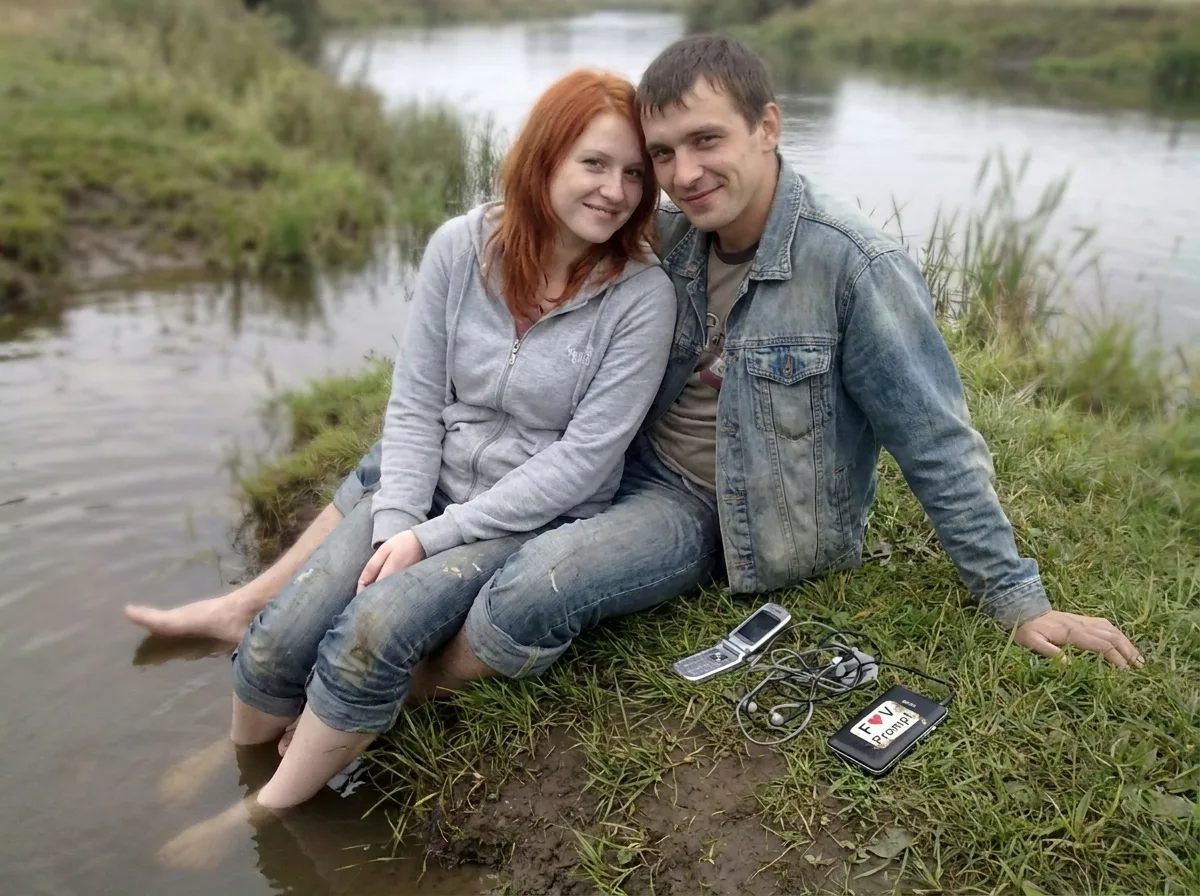 Washed-Out Riverbank Couple Phone Photo