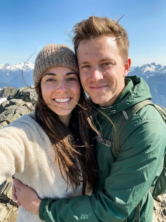 Windswept Mountain Summit Couple Selfie